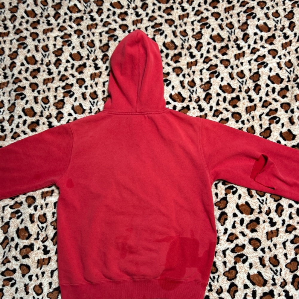Fox racing hoodie.Rip in the right sleeve gives this hoodie a bit of personality